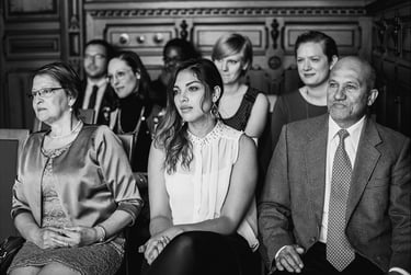 Wedding guests watching a civil ceremony.
