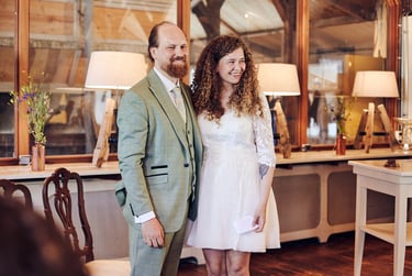 Bride and groom standing in front of guests after the ceremony.