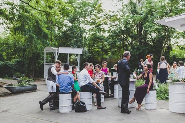 The outdoor area of the old carpet factory filled with wedding guests.