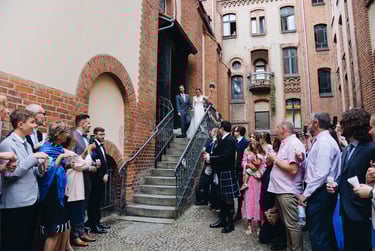 Newlywed couple exiting church.