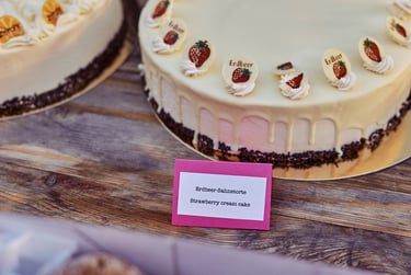 A strawberry cream cake on a table.