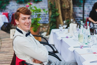 Red haired wedding guests sitting at a table.