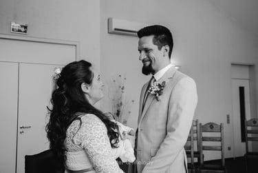 Groom looking into the bride's eyes during a wedding ceremony.