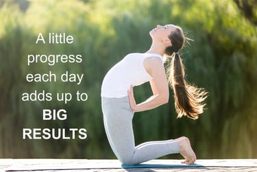 A woman in a white tank top practices a kneeling yoga pose outdoors with a motivational quote about progress.