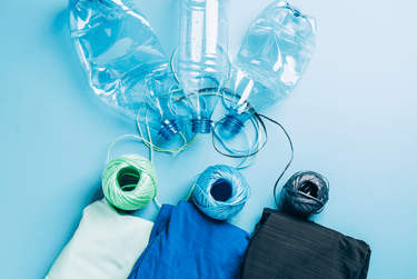 plastic bottle being recycled to fabric