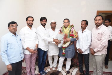 a group of men standing around a man in a white shirt