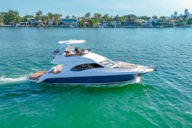 affordable yacht rental in Miami under $1500 cruising on clear blue ocean