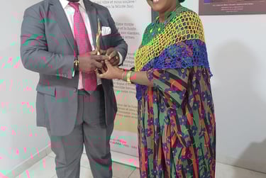 a man and woman standing next to a poster
