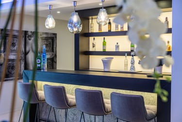 Modern private bar with designer seating at Villa Serenity Marbella