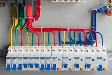 Suasana Electrical Services installing neat, organized circuit breaker wiring panel.