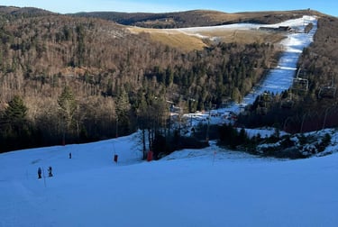 a ski slope with people skiing down it