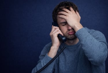 Frustrated customer experiencing a stressful customer service phone call