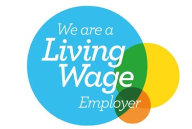 Official Living Wage Employer logo featuring colorful overlapping circles and white text.