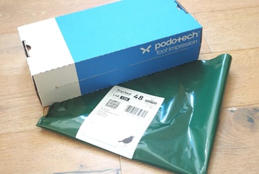 a  foot impression box with returns envelope
