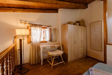 Tonia's cottage bedroom with a desk and a chair