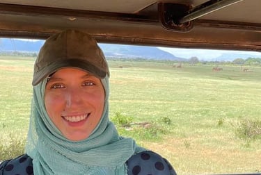 Sara with elephants in distance