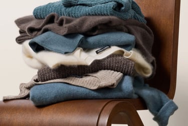 Rack of neutral-toned Eileen Fisher garments made from organic cotton and wool