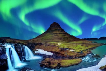 Vibrant green Northern Lights over Kirkjufell mountain and waterfall in Iceland.