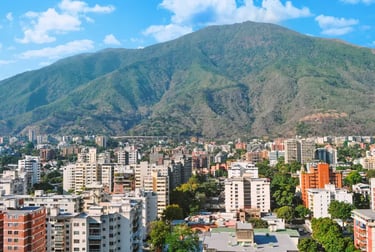 Panoramic view of Caracas city skyline with high-rise buildings and El Avila mountain in Venezuela.