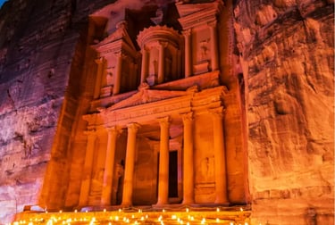 The Treasury at Petra, Jordan, illuminated by hundreds of candles at night.