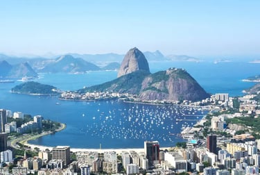 Panoramic aerial view of Sugarloaf Mountain and Botafogo Bay with boats in Rio de Janeiro, Brazil.