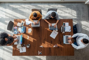 Four entrepreneurs are working on different business models at the startup workspace