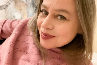 Close-up on Stefanie wearing a pink jumper.