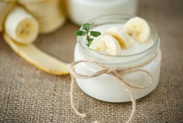 a jar of yogurt with bananas and yogurt
