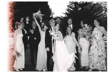 Bride and groom celebrating with their bridal party after the ceremony