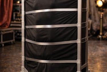 Professional aluminum flight case with black fabric lining on wheels for stage equipment storage.