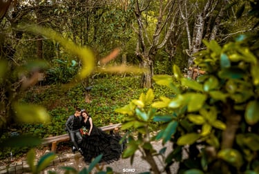 a couple kissing in a forest