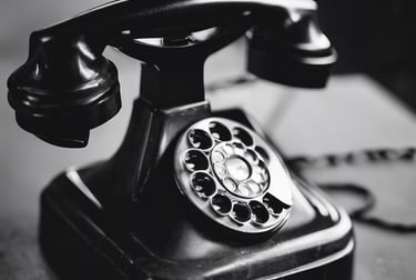 Black and white image of a vintage telephone