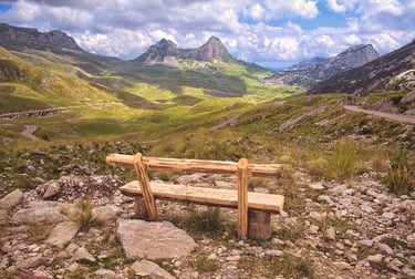 Wooden bench facing Durmitor National Park mountain peaks