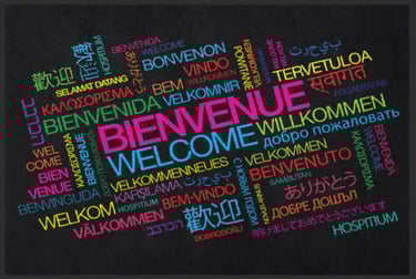 a black and white welcome sign with a colorful welcome sign