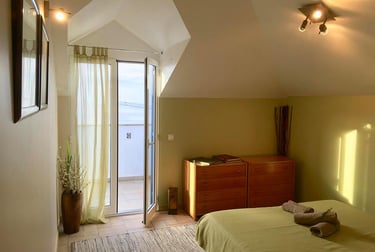 earth bedroom with a bed and a dresser