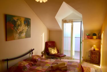 fire bedroom with a bed and a chair