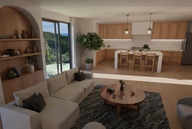 Modern open concept living room and kitchen featuring a white sectional sofa and wood island.
