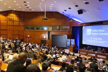 a large group of people sitting in a large room