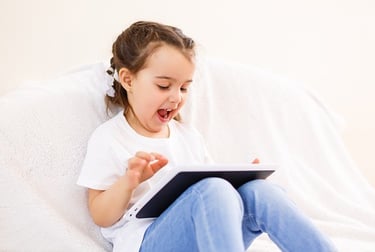 Girl using a tablet under parental control