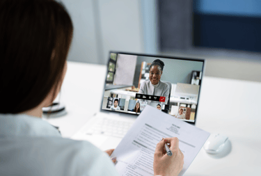 a business owner is in a meeting with her virtual finance team