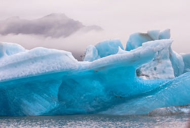 Anchorage, AK -A broken Iceberg floating in the lake at Portage Glacier