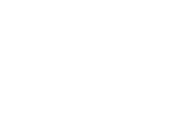 a house with a clock on the front and a clock on the outside
