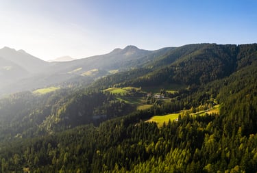 a mountain scene with a view of a valley
