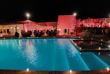 a pool with candles and candles on the side of it