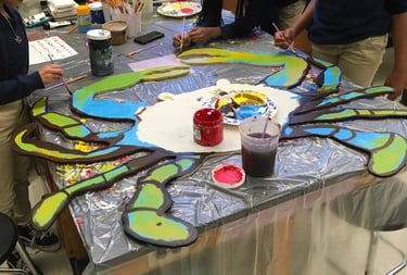 Eastport Elementary School students work on collaborative artwork with Arturo Ho