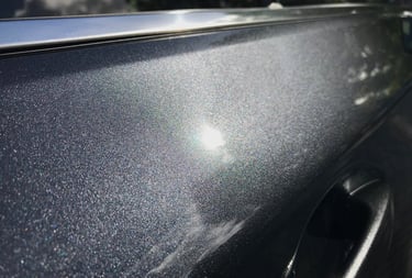 a car with a shiny silver paint job