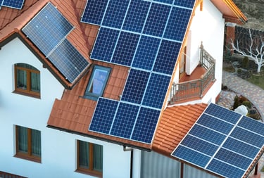 a man working on a roof with solar panels