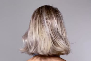 Close-up of woman's highlighted hair with soft waves