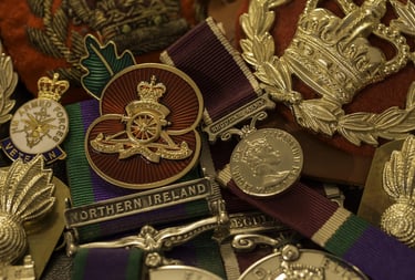 a collection of military medals and campaign ribbons