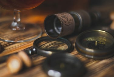 antique compass, binoculars, monocle and magnifying glass